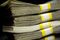 Stacks of U.S. currency are arranged for a photograph in Washington, D.C., U.S., on Thursday, Feb. 6, 2014.