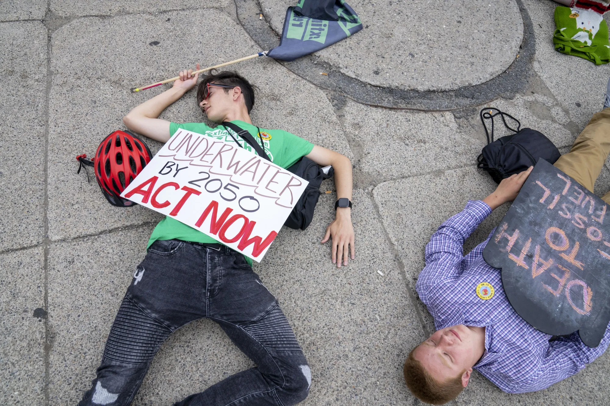 Extinction Rebellion demonstrators during a die-in for climate change in Boston last year. The activists say they are stopping disruptive actions in the UK.