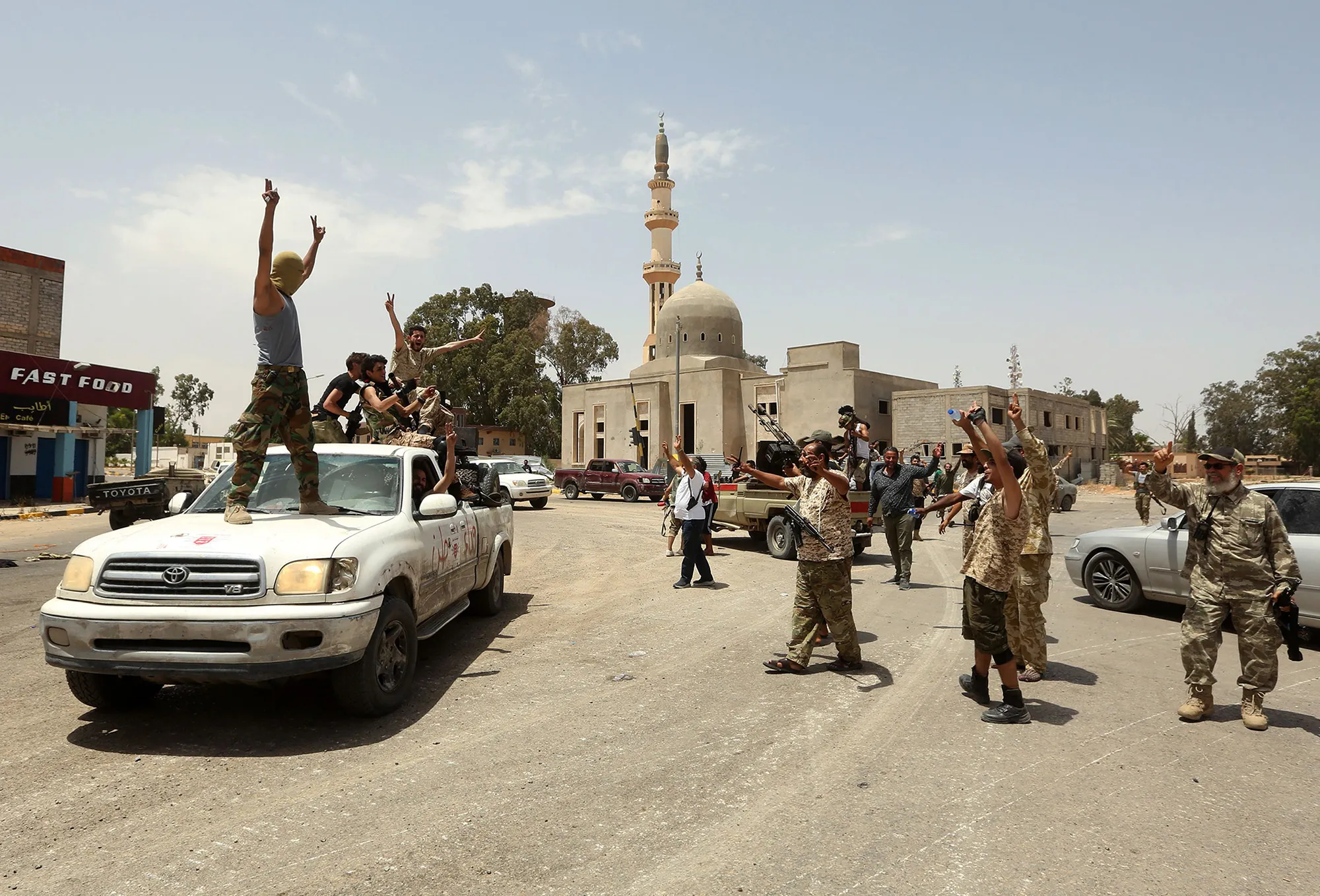 Fighters loyal to the internationally recognized Libyan government&nbsp;gather in the&nbsp;Qasr bin Ghashir district south of Tripoli, on June 4.