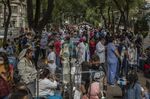 Medical staff and patients gather outside a hospital during an earthquake in Mexico City on June 23.