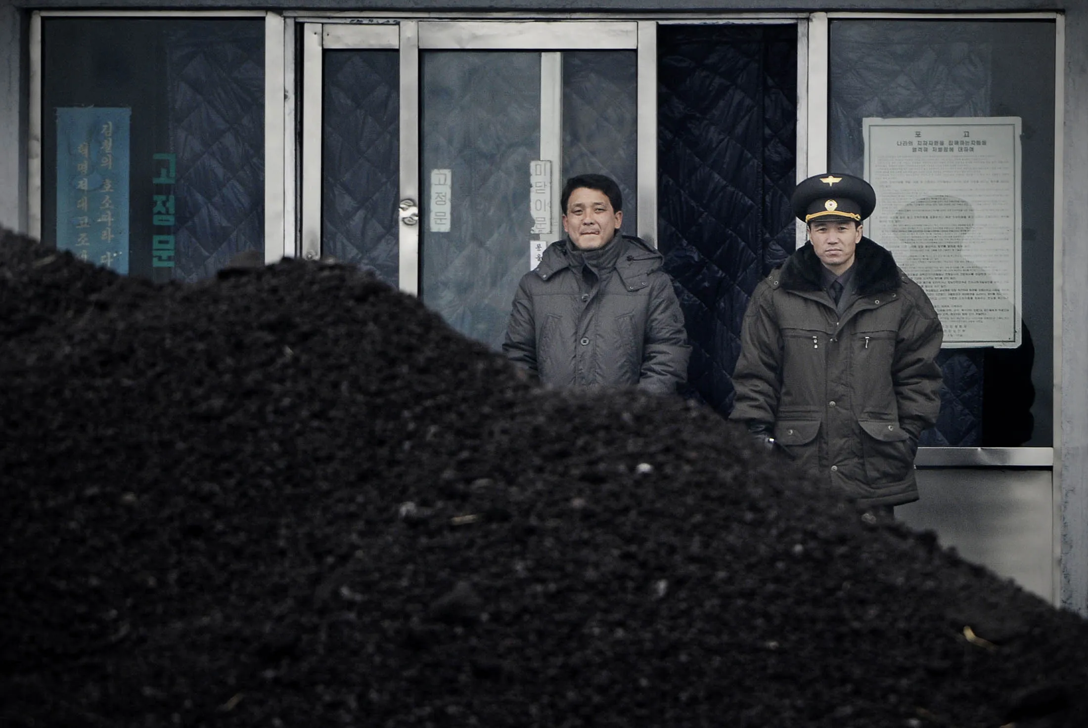 Coal stands at&nbsp;the border town of Siniuju, North Korea.&nbsp;
