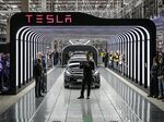 Elon Musk, center, and Olaf Scholz, left, attend the start of production at the Tesla Gigafactory in Gruenheide, Germany, on March 22.