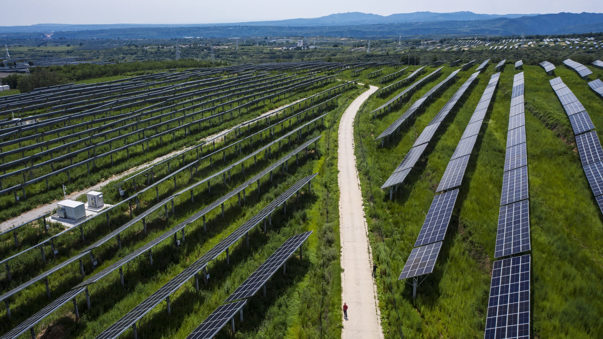 A solar power plant co-owned by Longi Green Energy Technology Co. and China Three Gorges Corp. in Tongchuan, Shaanxi Province, China operates on July 20, 2020.