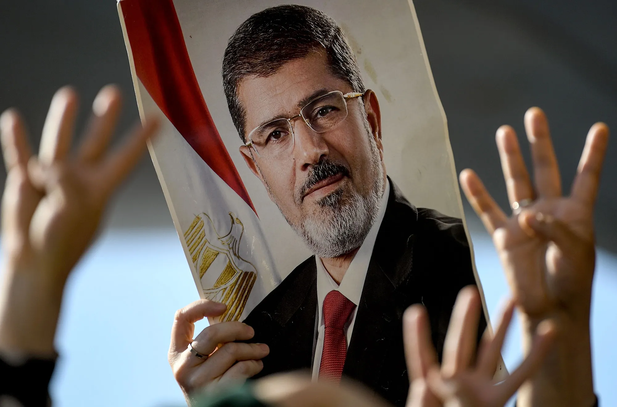 People hold a poster of former Egyptian President Mohamed Mursi&nbsp;in Istanbul.&nbsp;