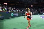 Naomi Osaka walks off court after her straight sets defeat against Veronika Kudermetova on March 12.