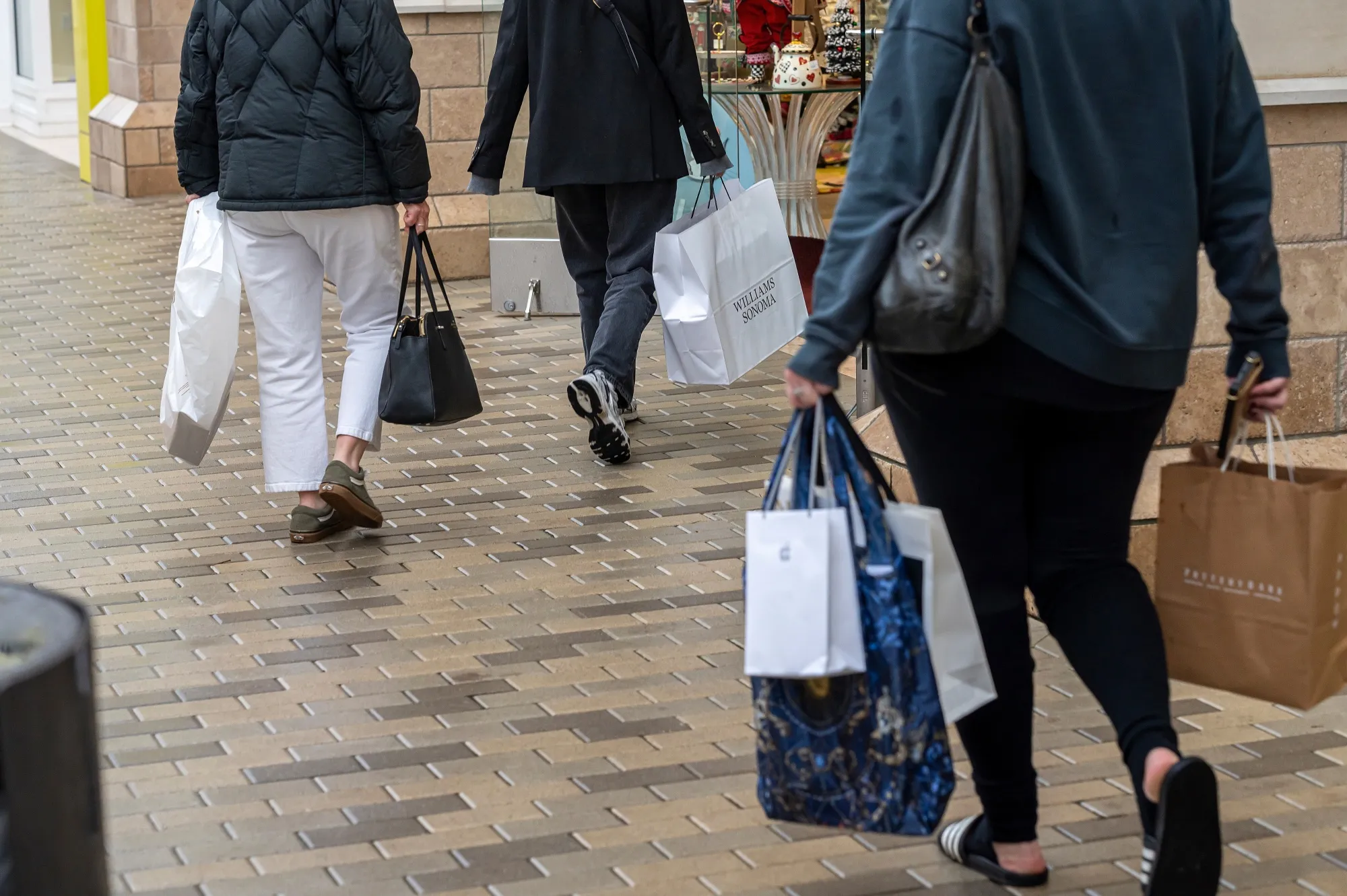 Shoppers carry bags at Broadway Plaza in Walnut Creek, California.
