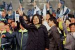 Tsai Ing-wen, Taiwan's president-elect, center, waves to supporters after delivering her victory speech in Taipei.
