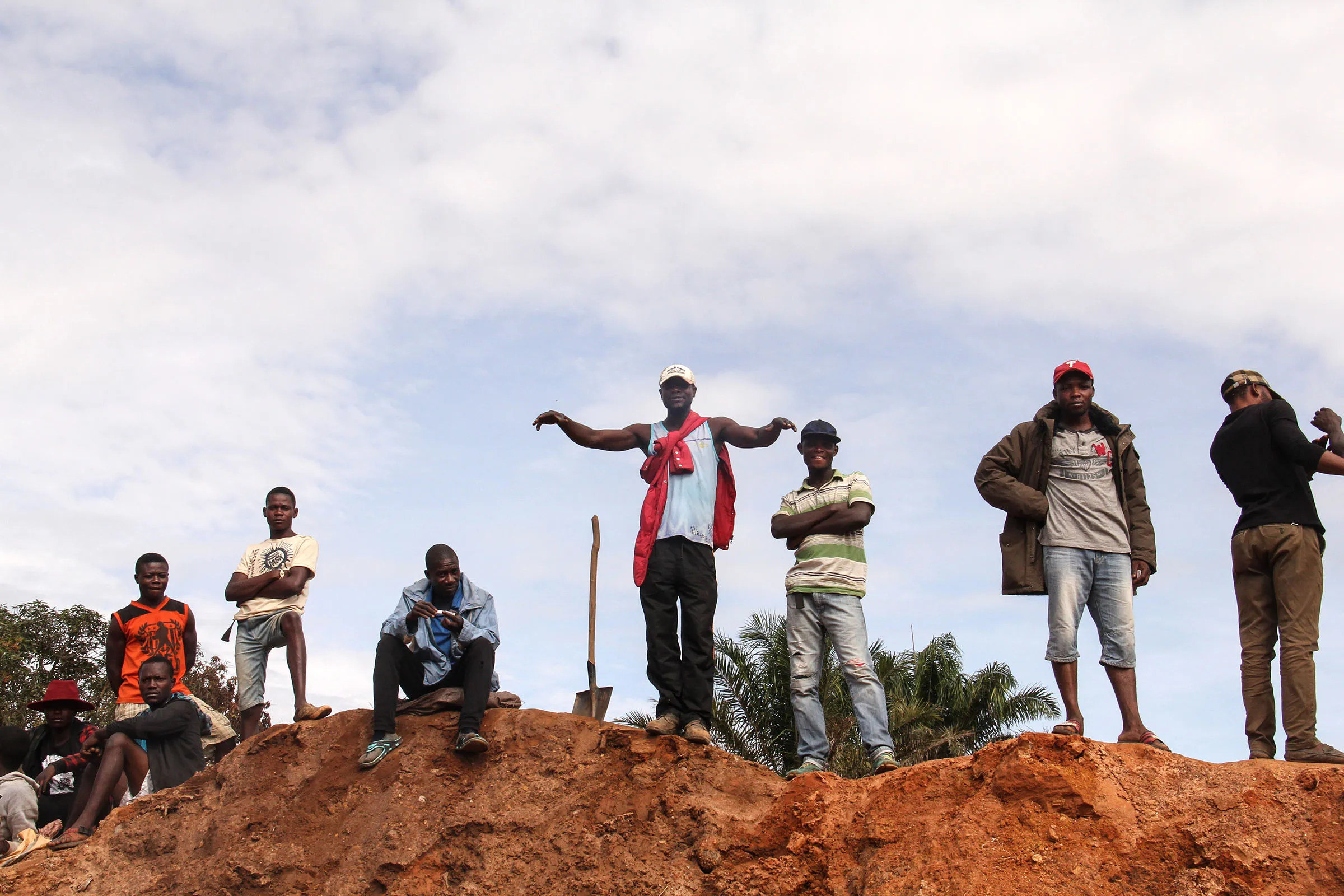 So-called artisanal miners wait to start digging for cobalt in a freshly excavated pit at the Kasulo township in Kolwezi, Democratic Republic of the Congo.