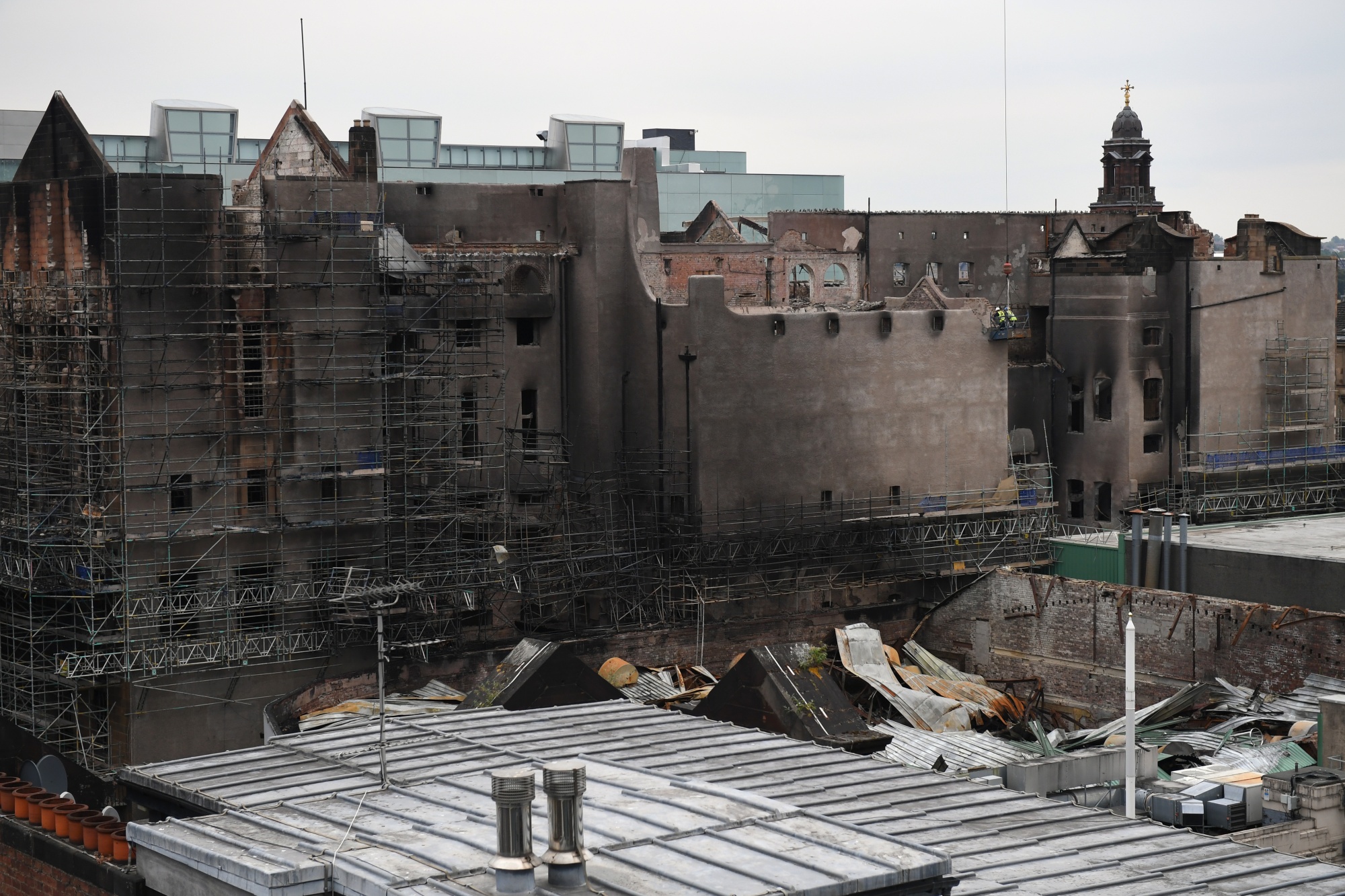GLASGOW, SCOTLAND - JULY 10: A skyline view before work begins on the demolition of the burnt-out Glasgow Art School on July 10, 2018 in Glasgow, Scotland. The grade A listed building was undergoing a multi-million-pound restoration when it was hit by fire on June 15, 2018 following a smaller blaze in May 2014. Built in the late 1890's by Charles Rennie Mackintosh, then a junior draughtsman, the building is widely considered to be his masterpiece. (Photo by Jeff J Mitchell/Getty Images) Photographer: Jeff J Mitchell/Getty Images Europe