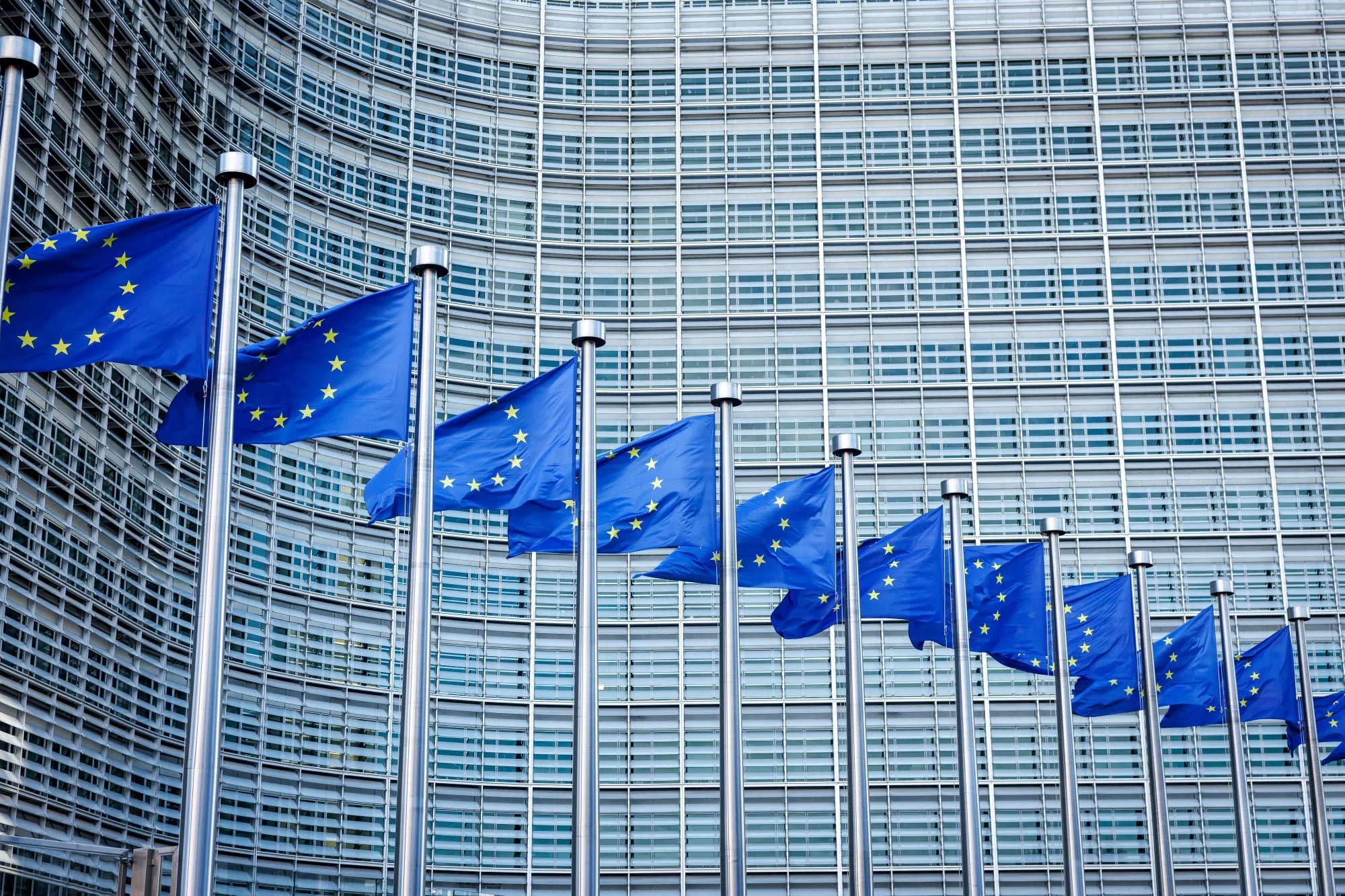 Flags of the European Union in front of the Berlaymont Building, which houses the European Commission’s headquarters in Brussels, Belgium.