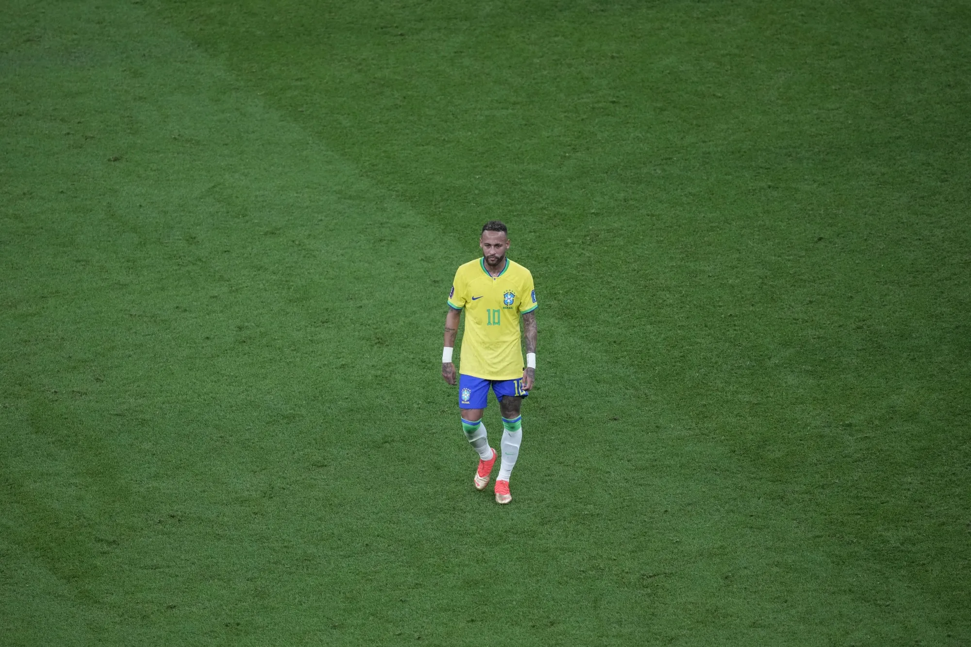 Brazil's Neymar walks on the pitch during the World Cup group G soccer match between Brazil and Serbia, at the the Lusail Stadium in Lusail, Qatar on Thursday, Nov. 24, 2022. (AP Photo/Darko Vojinovic)