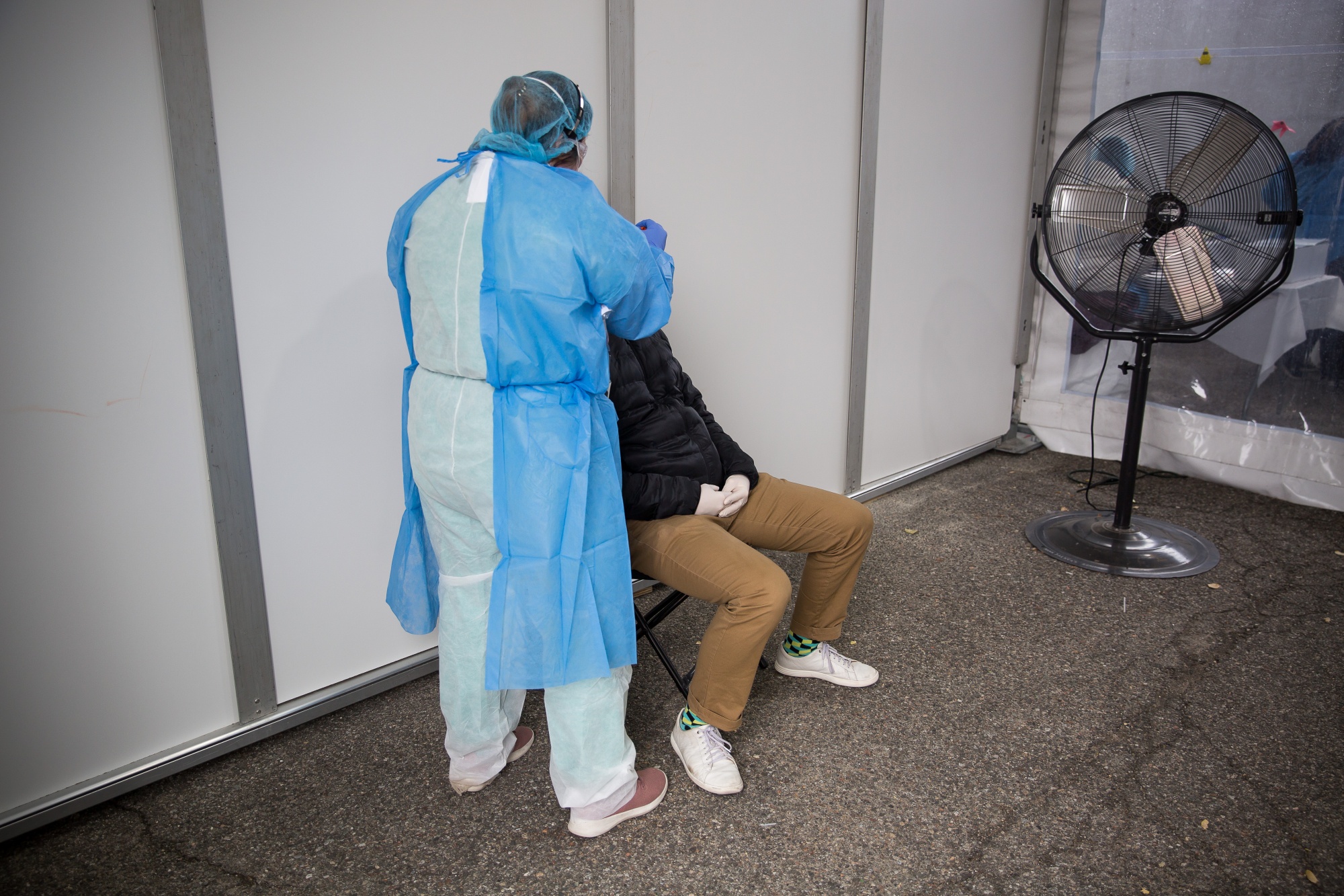 A nurse practitioner swabs a patient at a Covid-19 testing center in Brooklyn, New York on April 20.