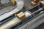 A package moves along a conveyor belt at the Overstock.com Inc.