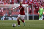 Denmark's Christian Eriksen controls the ball during the Euro 2020 soccer championship group B match between Denmark and Finland at Parken stadium in Copenhagen, June 12, 2021. Denmark international Christian Eriksen is training with the second team at his former club Ajax to stay fit while he seeks a new club. The 29-year-old playmaker has not played since collapsing during Denmark’s opening match at the European Championship against Finland in June. His contract with Inter Milan was terminated by mutual agreement last month because he is unable to play in Italy since being fitted with an implantable cardioverter-defibrillator. (Wolfgang Rattay/Pool via AP, file)