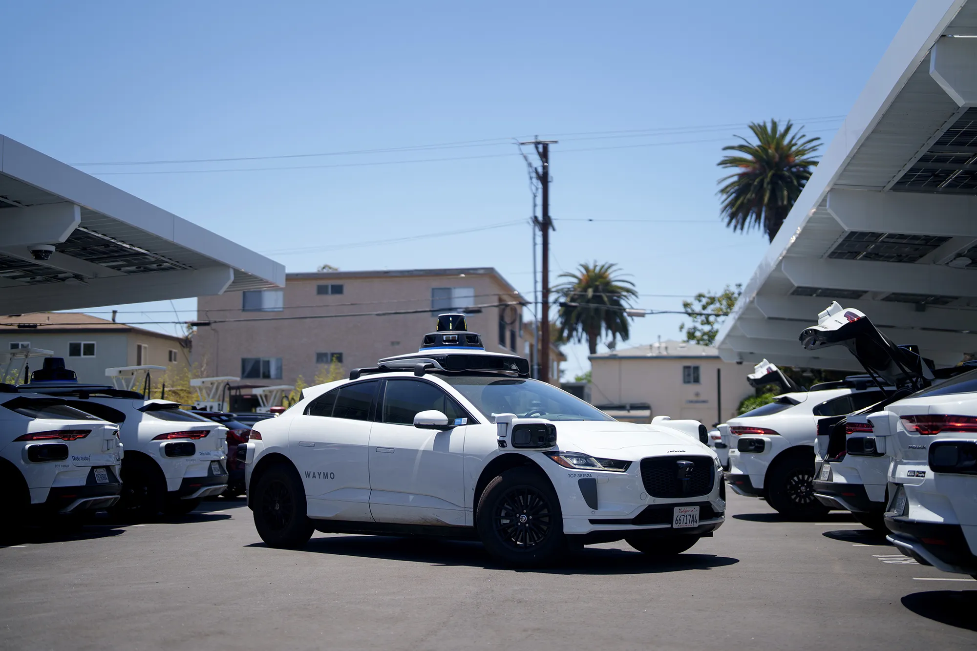 Waymo vehicles at a charging station in Santa Monica, California.