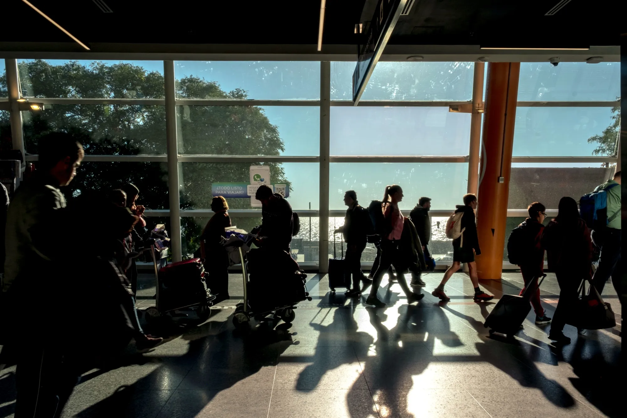 Travelers at Aeroparque Jorge Newbery Airport.
