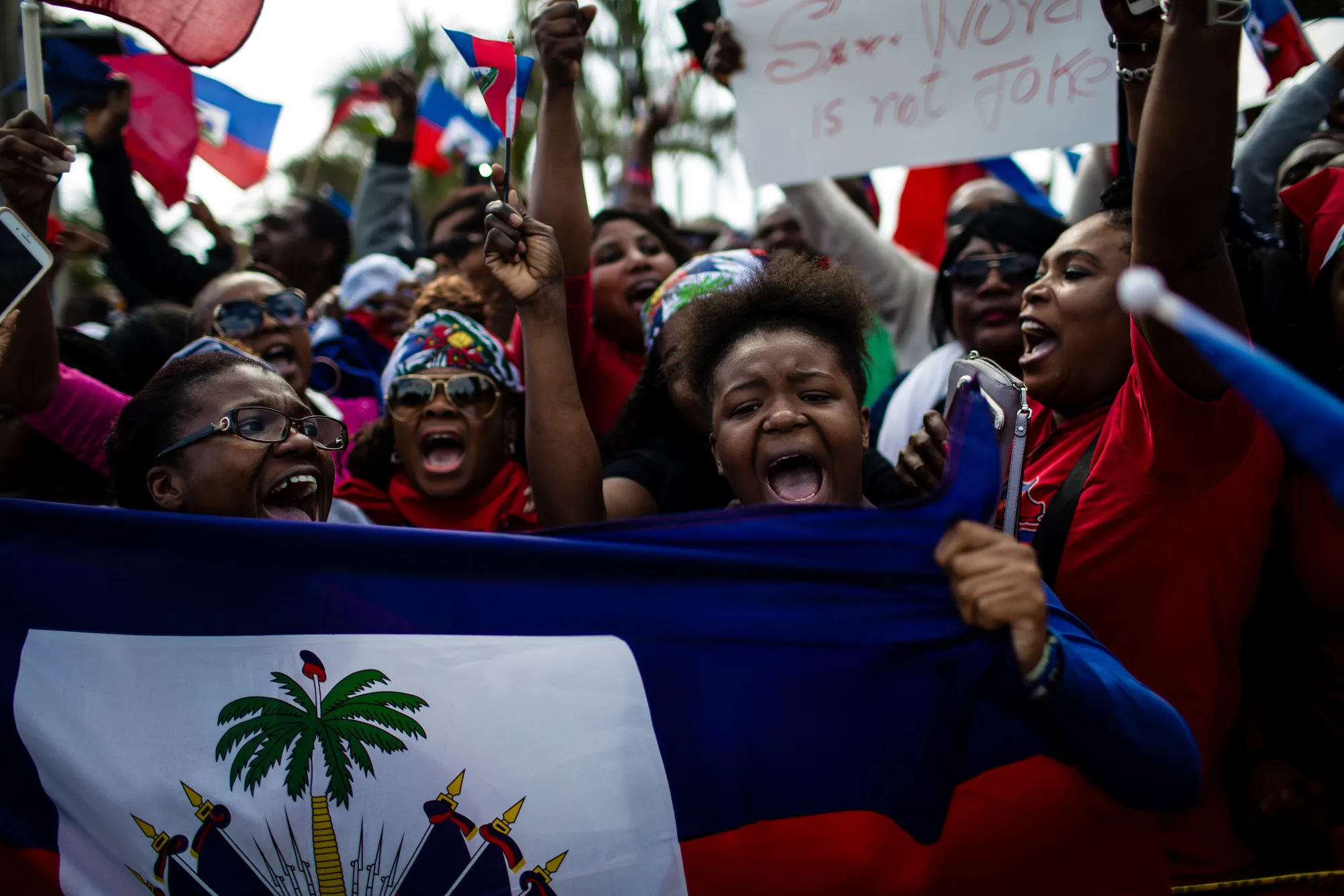 Demonstrators hold Haitian flags and chant during a protest against&nbsp;President Donald Trump&nbsp;in Palm Beach, Florida,&nbsp;on&nbsp;Jan. 15, 2018.&nbsp;