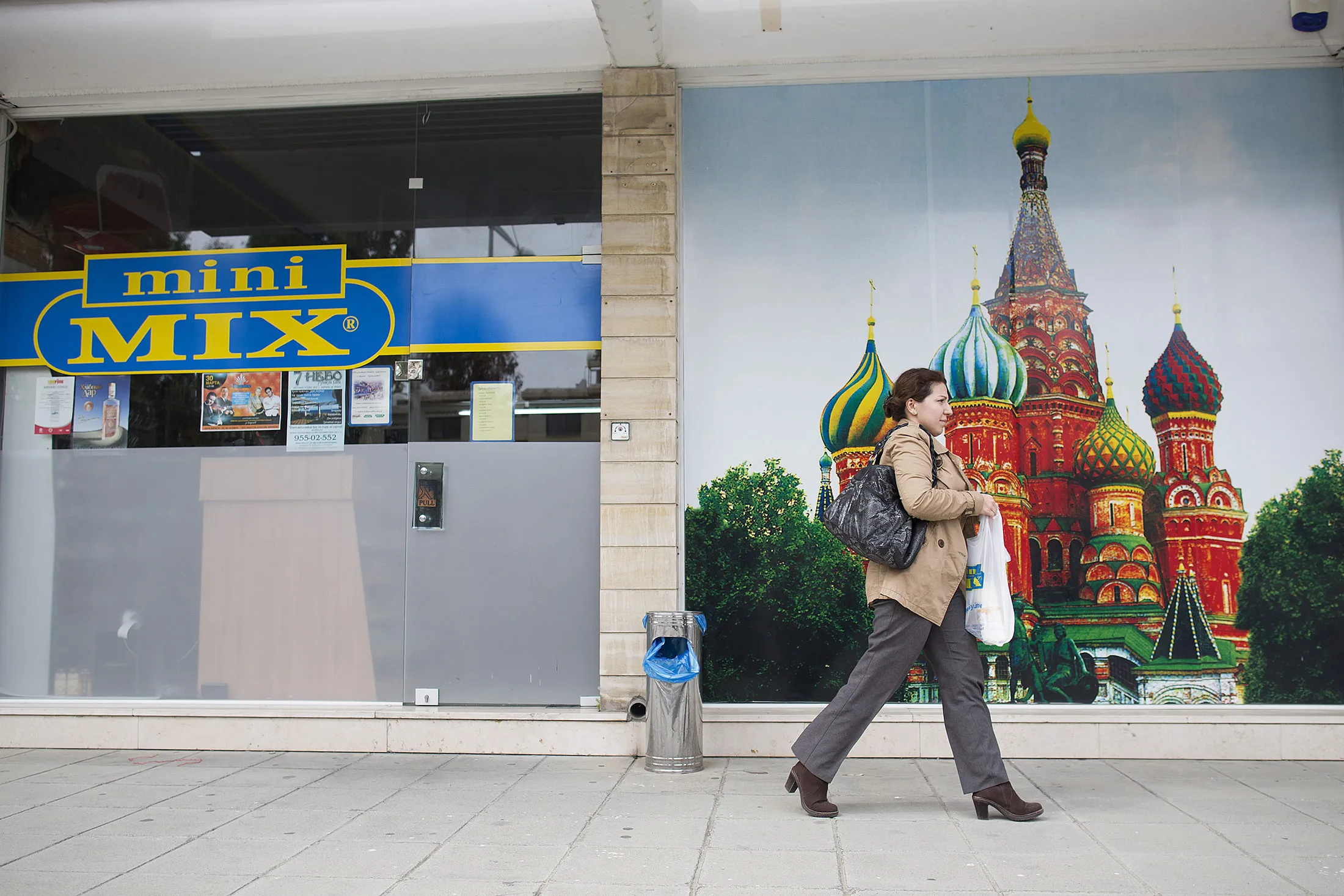 A customer exits a Russian supermarket in Limassol, Cyprus, on Thursday, March 21, 2013. The European Central Bank said it may cut Cypriot banks off from emergency funds after March 25 as the island nation's president, Nicos Anastasiades, scrambled to forge agreement on a plan to stave off financial collapse.

