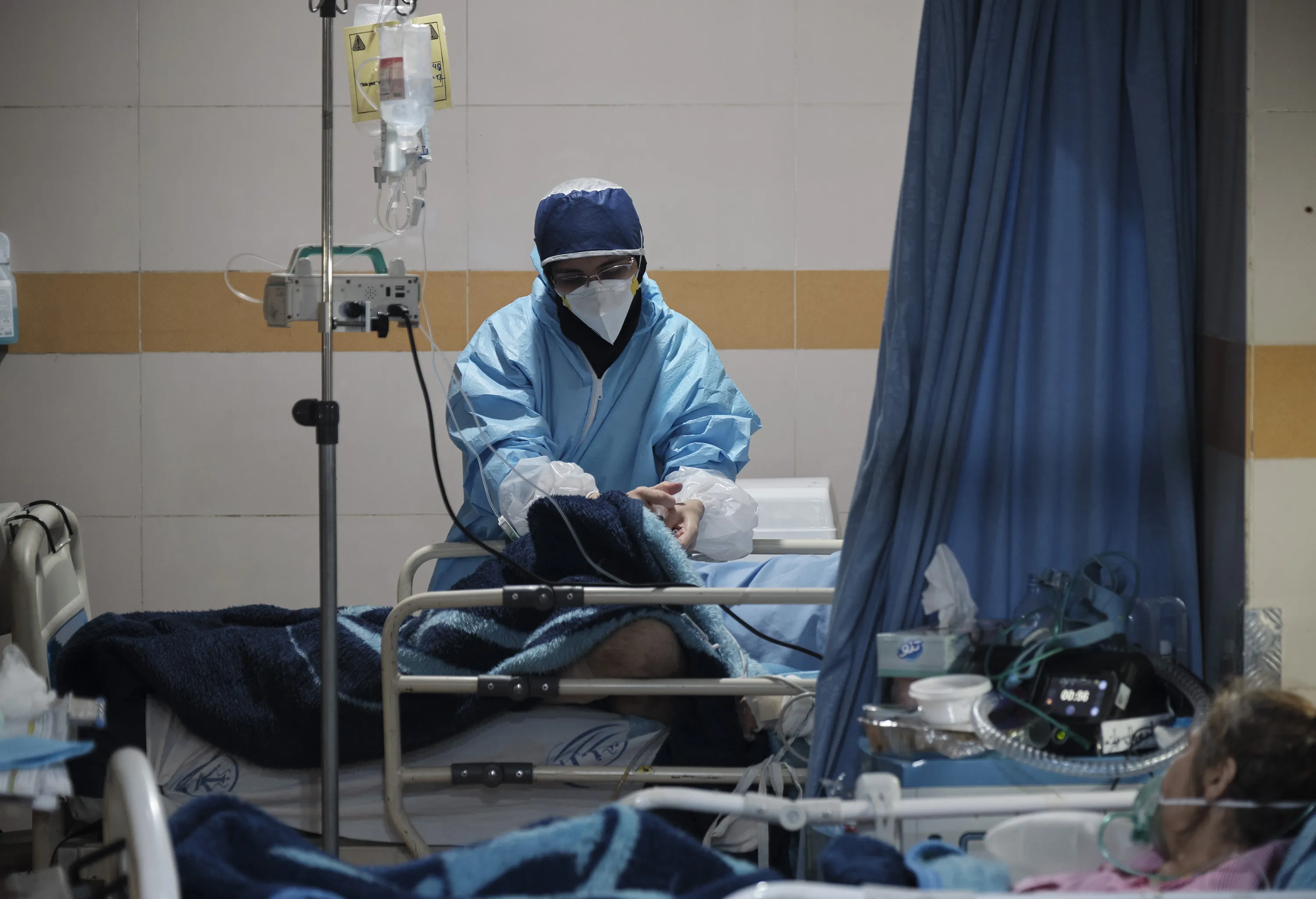 An medic tends to patients&nbsp;in a Covid-19 unit in a hospital in Tehran.
