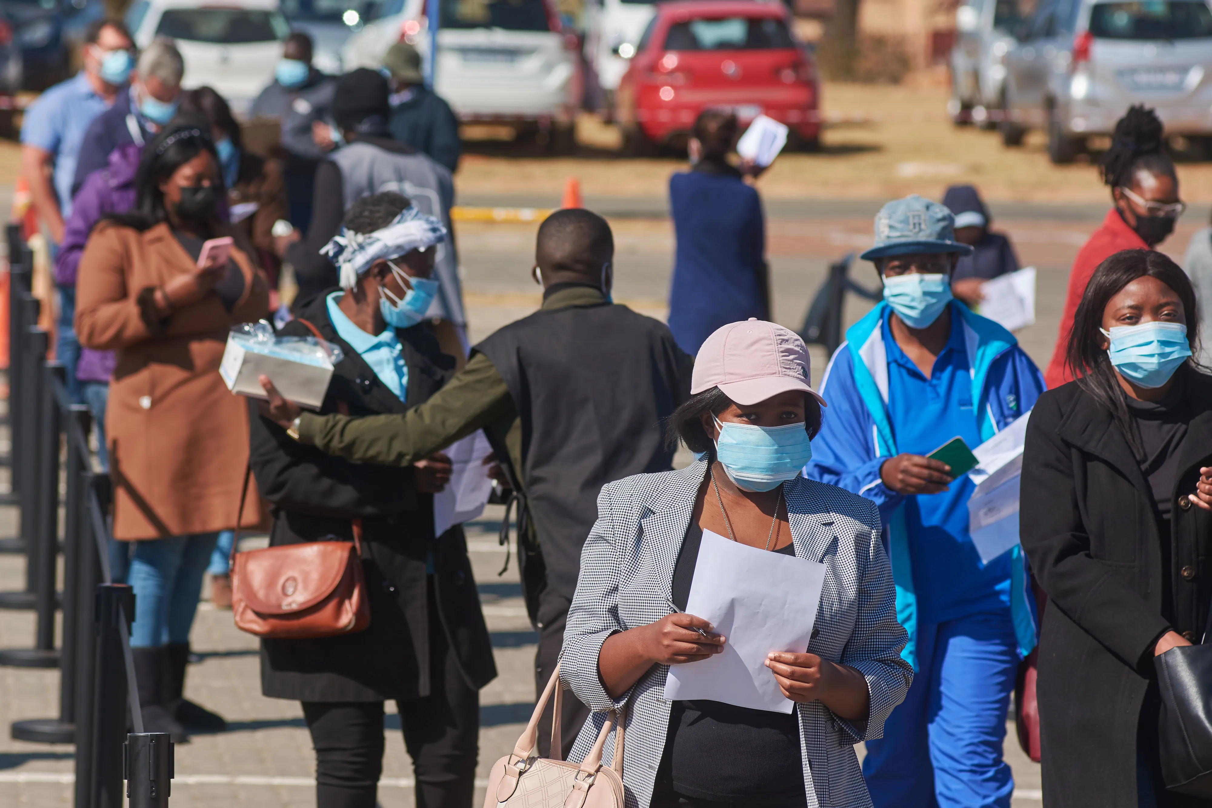 Residents wait in line to register outside a&nbsp;mass vaccination site in the Midrand district of Johannesburg this month.&nbsp;