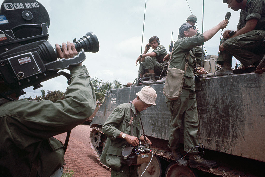 A CBS camera crew interviews American soldiers, Tay Ninh Road, Vietnam. 1967.