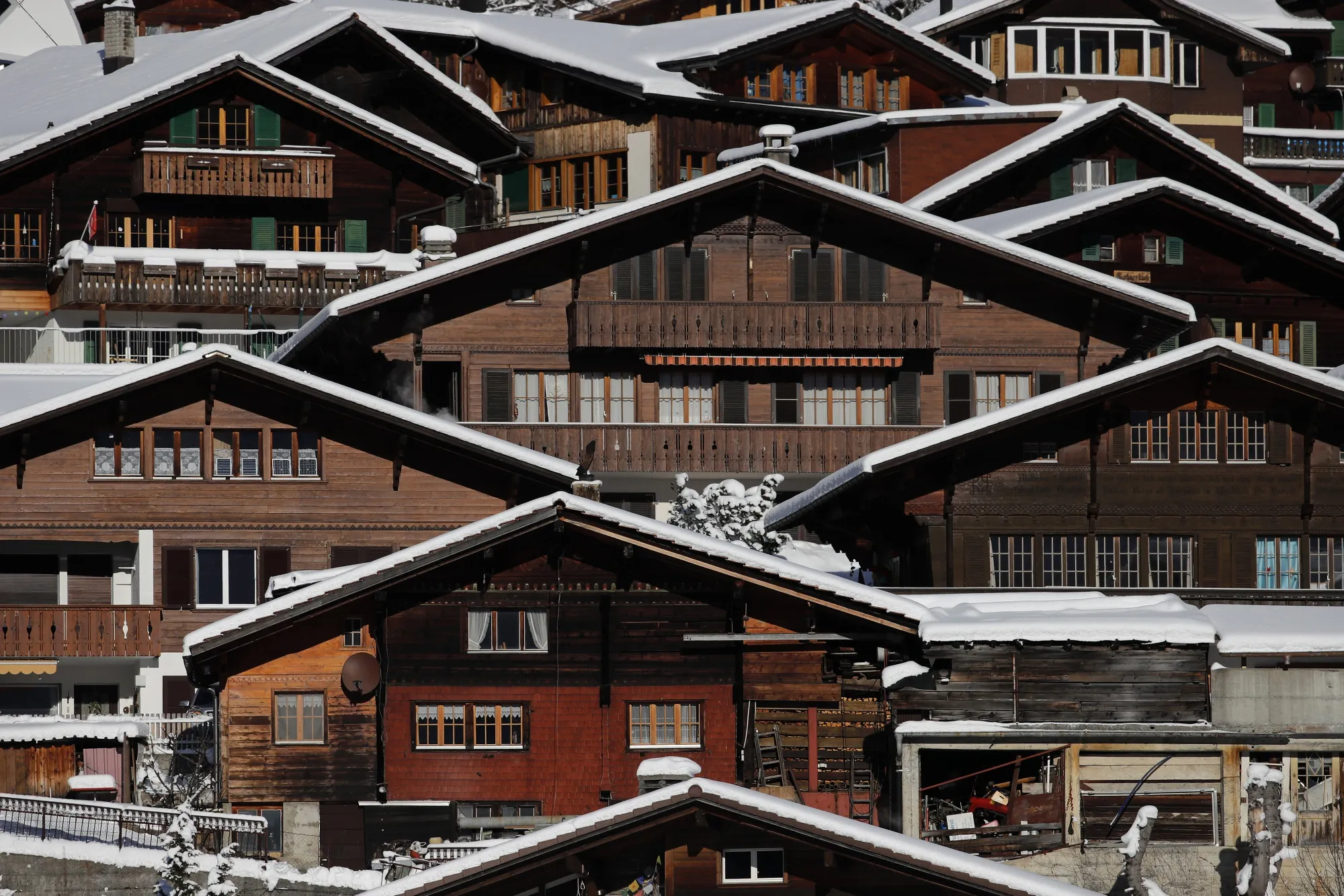 Traditional Swiss residential properties on a mountainside in Adelboden, Switzerland