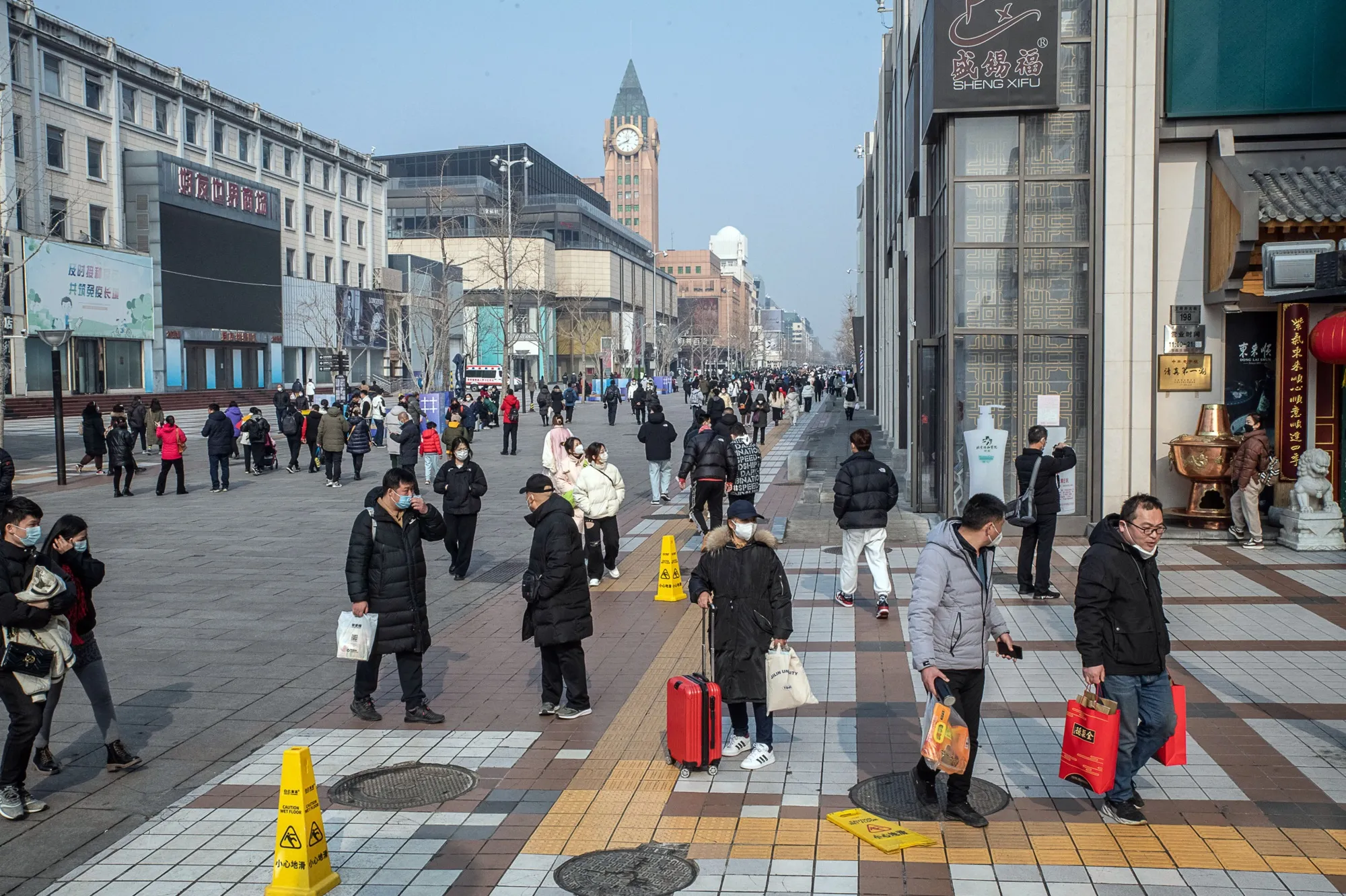 Pedestrians in the Wangfujing shopping area in Beijing on Feb. 10.