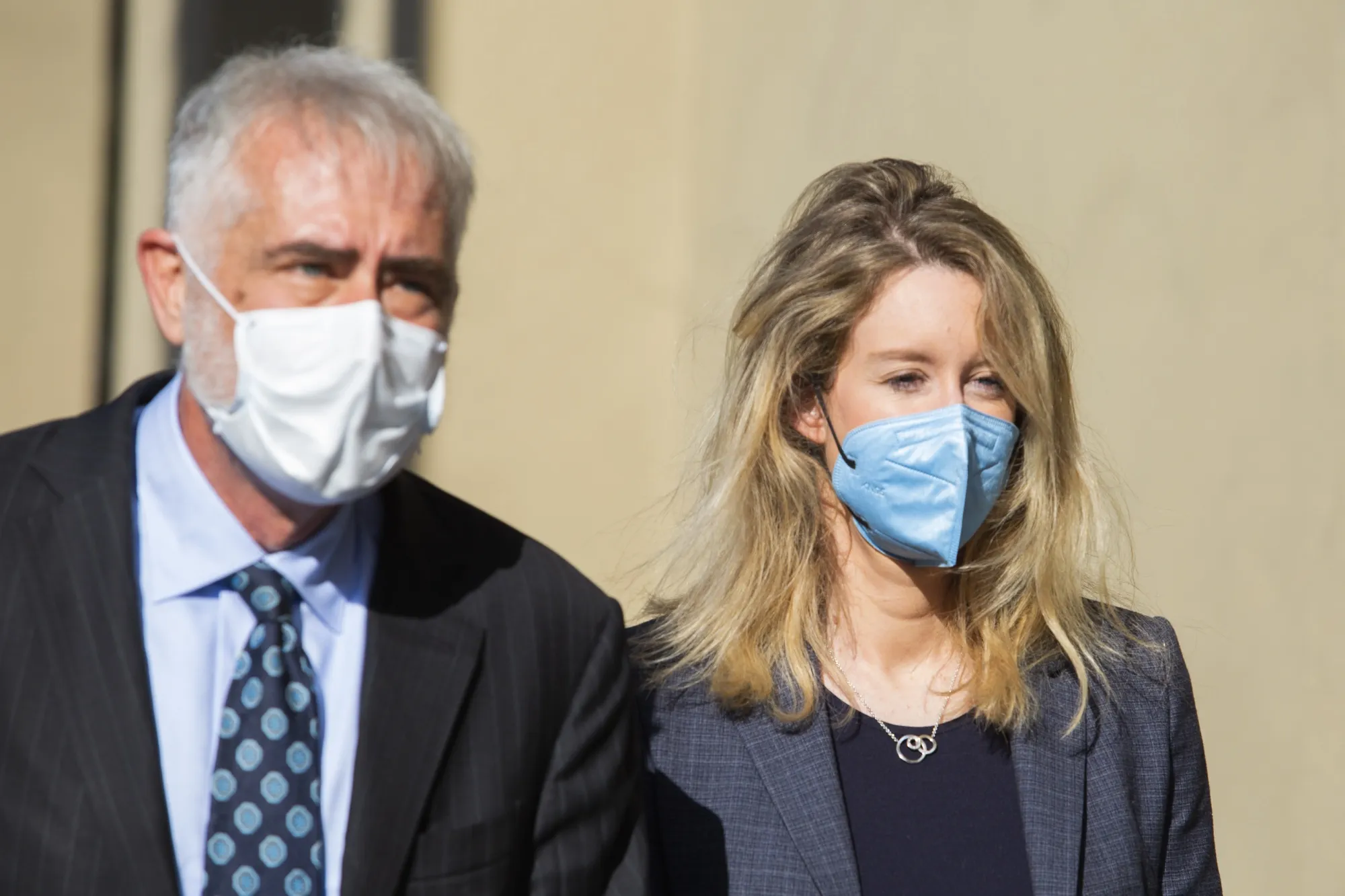 Elizabeth Holmes, right, exits U.S. federal court in San Jose, California, on May 6. 