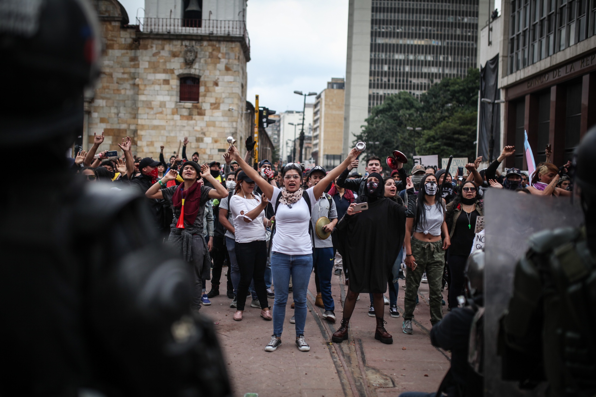 The Mobile Anti-Disturbances Squadron, disperse protesters in Bogota, on Nov. 23.