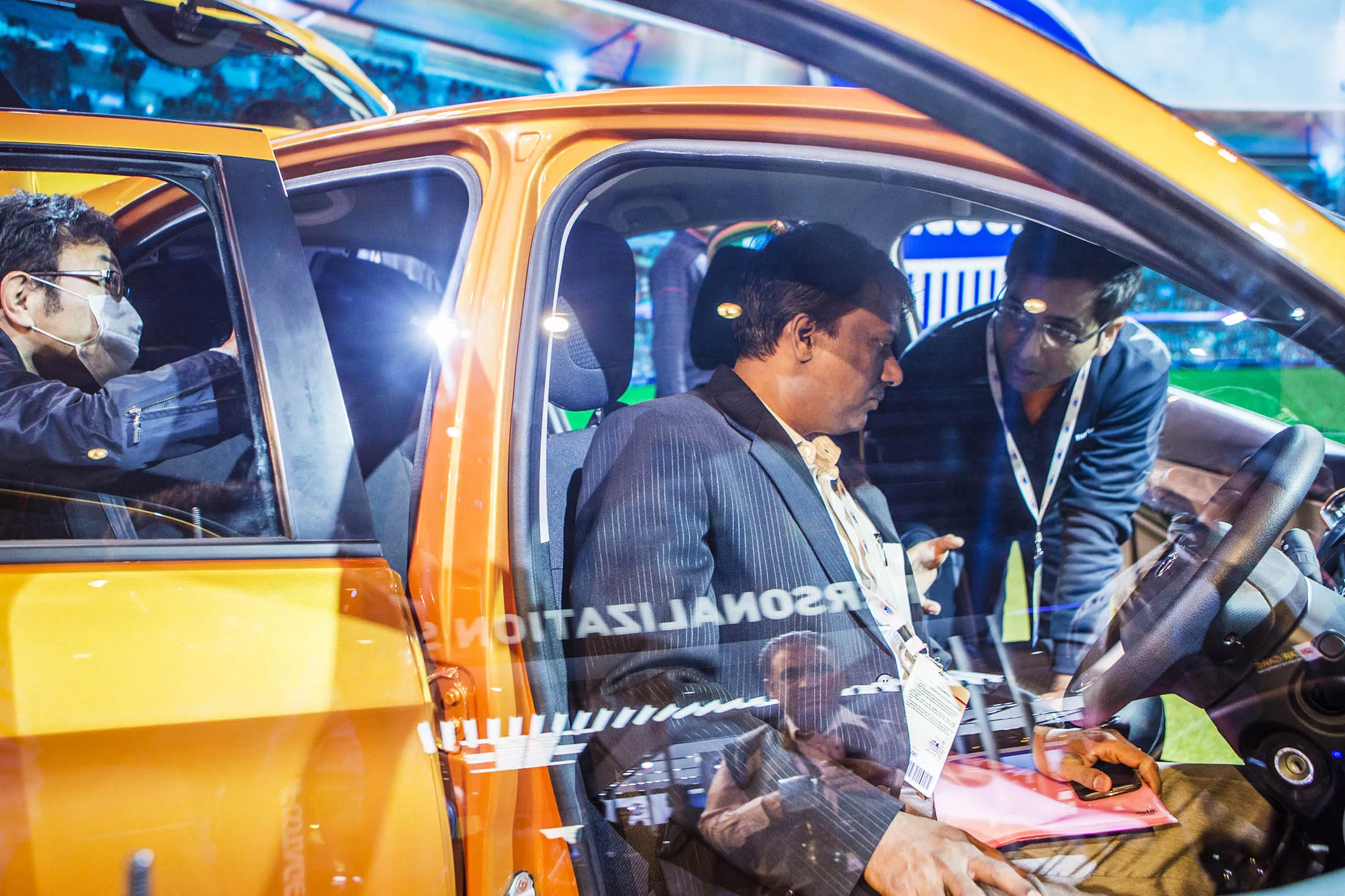 Attendees look at a Tata Motors Ltd. Zica hatchback car on display at the Auto Expo 2016 in Noida, Uttar Pradesh, India, on Thursday, Feb. 4, 2016. Tata Motors said it will rename the Zica, derived from “Zippy Car,” citing the outbreak of the Zika virus.
