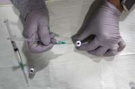 Healthcare Workers Administer Covid-19 Vaccines At Airport As U.S. Daily Cases Hit 14-Month Low