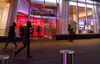Pedestrians pass in front of a Bank of America Corp. branch in New York.