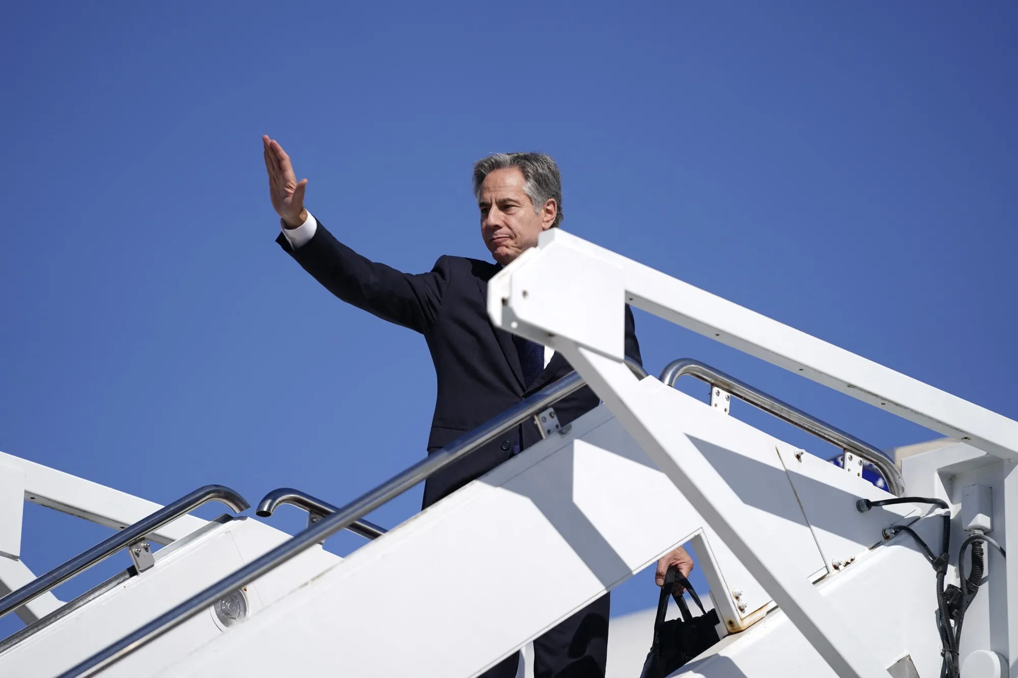 Antony Blinken boards his plane at Joint Base Andrews on Oct. 21.