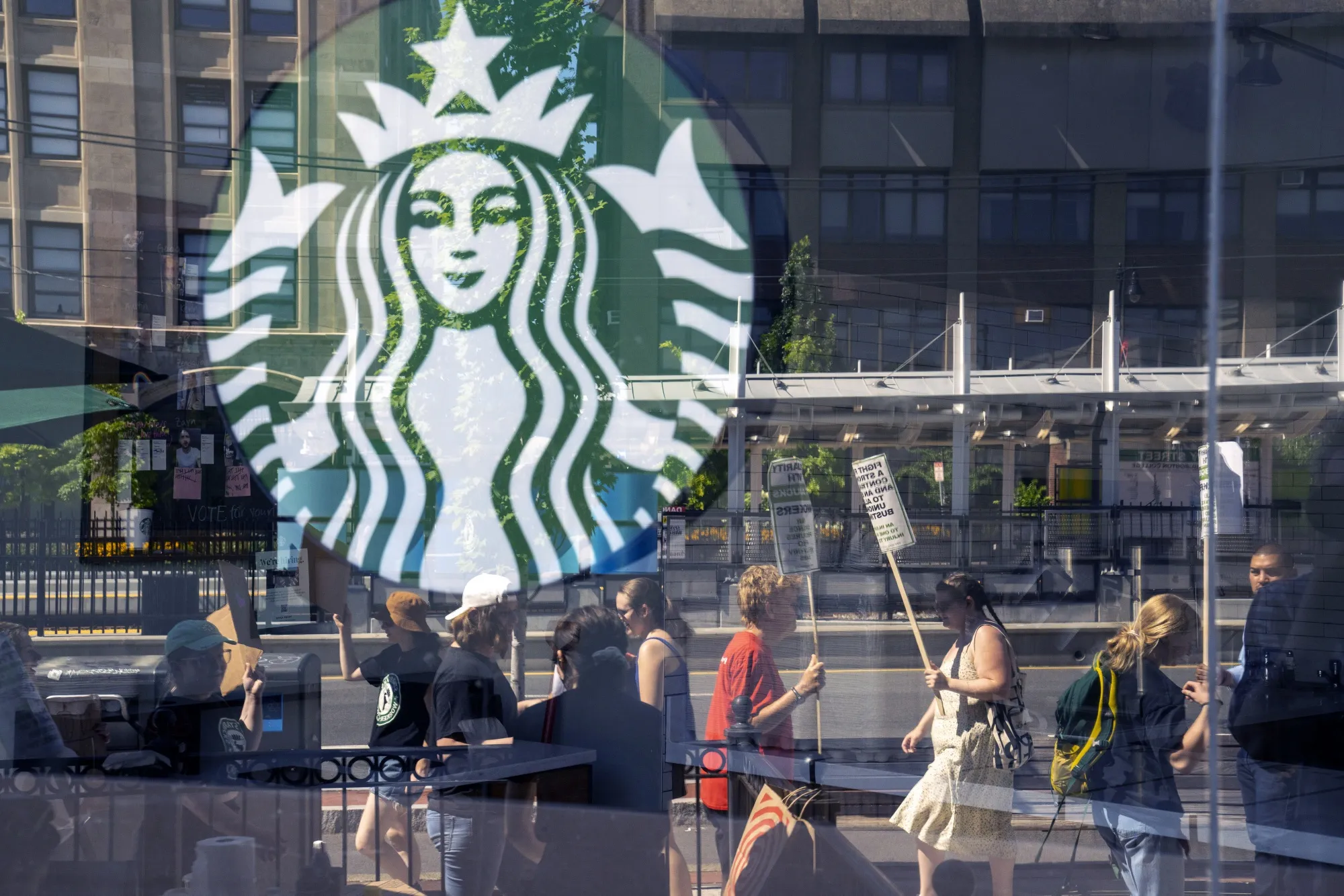 Unionized workers strike outside a Starbucks location in Boston, Massachusetts.&nbsp;