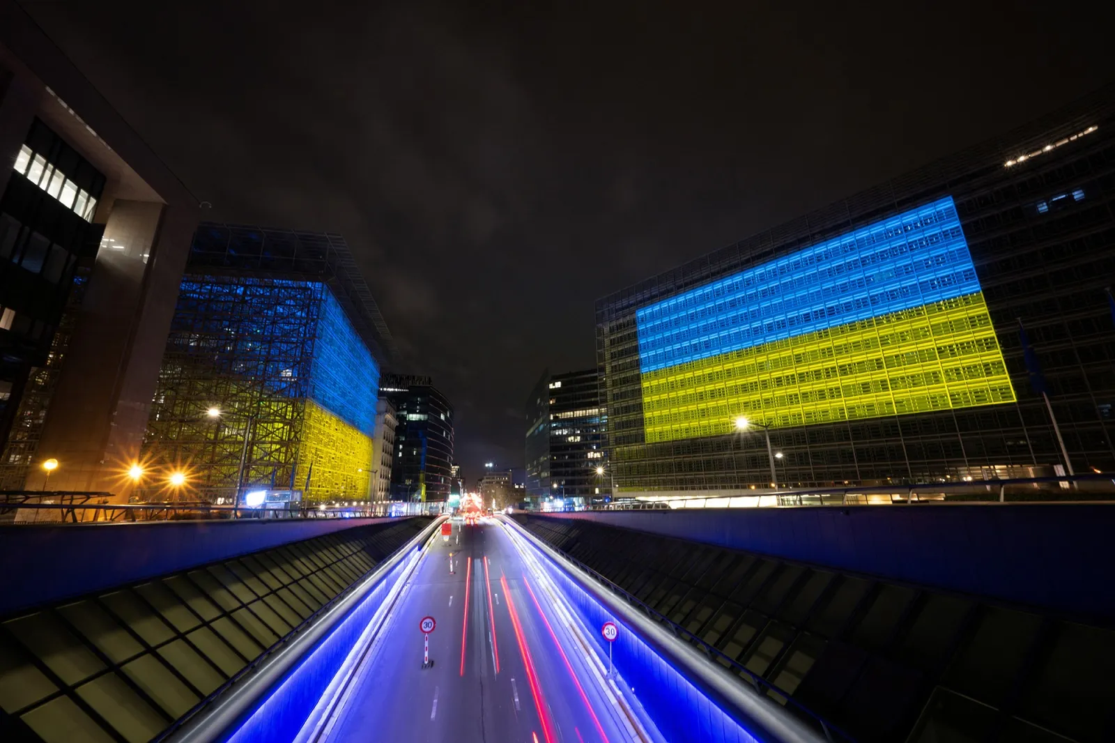 The European Union Council building, left, and the European Union Commission building illuminated with&nbsp;Ukraine's national flag in Brussels on Feb. 23.&nbsp;