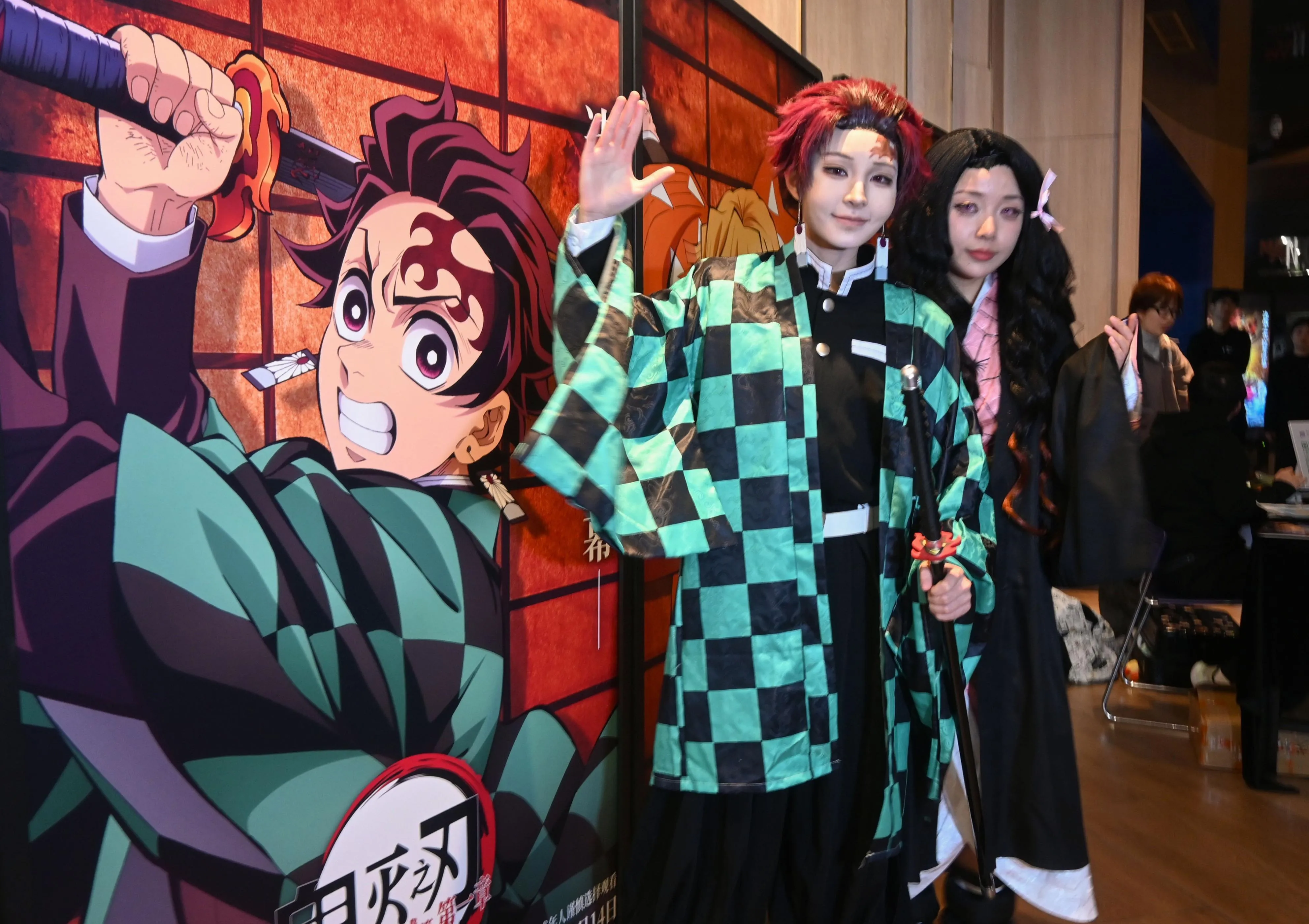 Cosplayers pose ahead of a screening of ‘Demon Slayer’ in Shanghai.