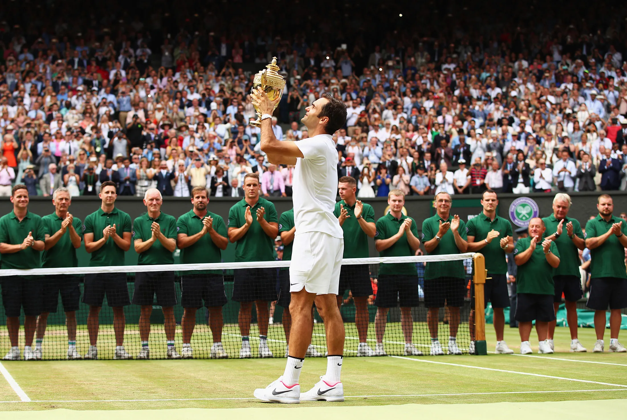 Roger Federer celebrates with the trophy after defeating Marin Cilic to win the Wimbledon Men's Singles tournament on July 16.
