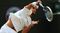 Rubin serves during the boys’ singles final match vs. Stefan Kozlov at Wimbledon on July 6, 2014