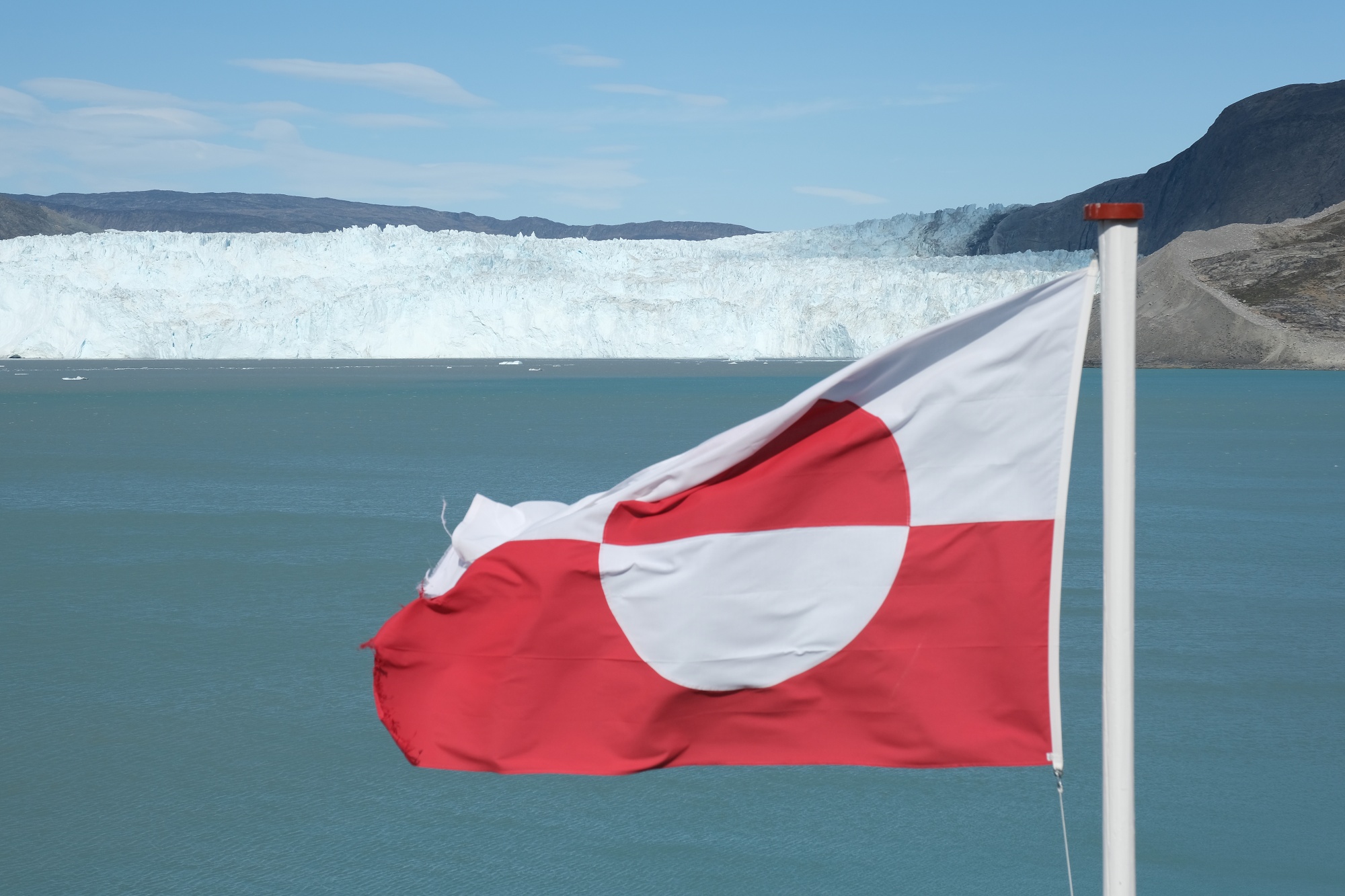 A Greenlandic flag flies near at Eqip Sermia, <b>Greenland</b>.&nbsp. 