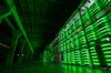 Illuminated mining rigs operate mounted inside racks at the BitRiver Rus LLC cryptocurrency mining farm in Bratsk, Russia, on Friday, Nov. 8, 2019. Bitriver, the largest data center in the former Soviet Union, was opened just a year ago, but has already won clients from all over the world, including the U.S., Japan and China. Most of them mine bitcoins.
