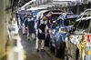 Workers inspect Subaru branded vehicles on the production line of Fuji Heavy Industries Ltd.'s Gunma Yajima Plant in Ota, Gunma, Japan, on Thursday, March 30, 2017. Fuji Heavy, best known for itsSubarubrand of cars, will change its name toSubaru Corp. from April 1.