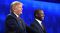 Republican presidential hopefuls Ben Carson and Donald Trump smile during the CNBC debate on Oct. 28, 2015, in Boulder, Colorado.