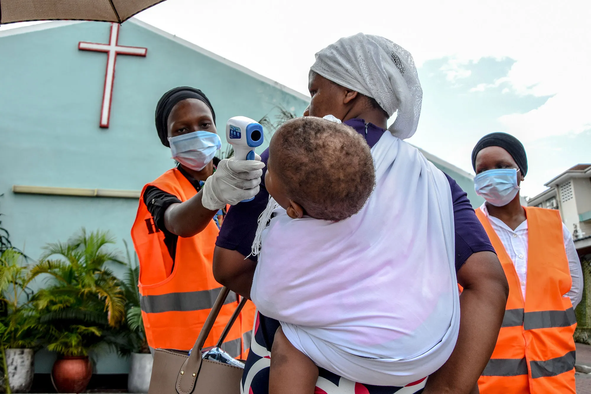 Church members check temperature at mass&nbsp;in Dar es Salaam, Tanzania.