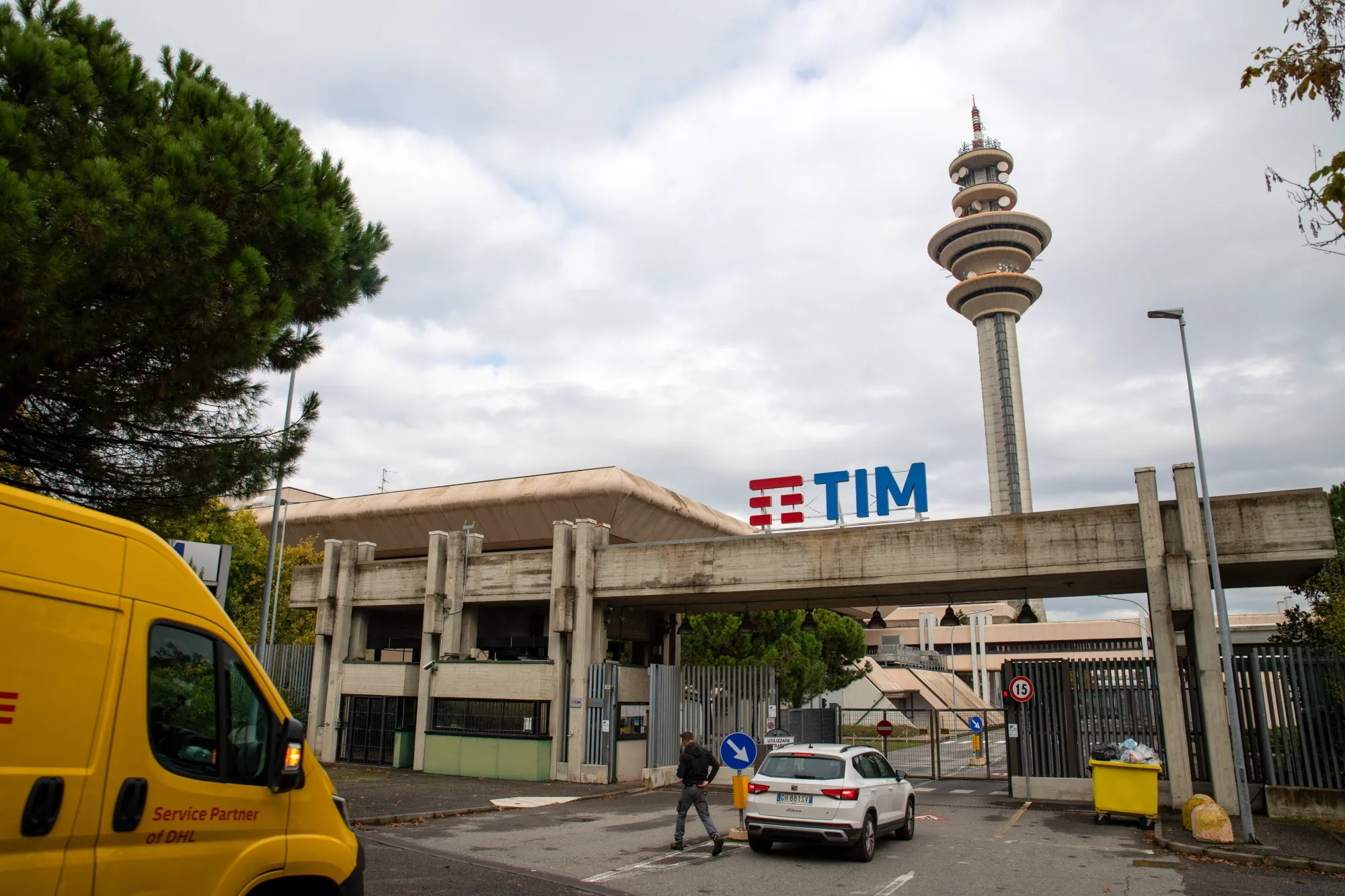 An entrance to the headquarters of Telecom Italia SpA in Rozzano, Italy.