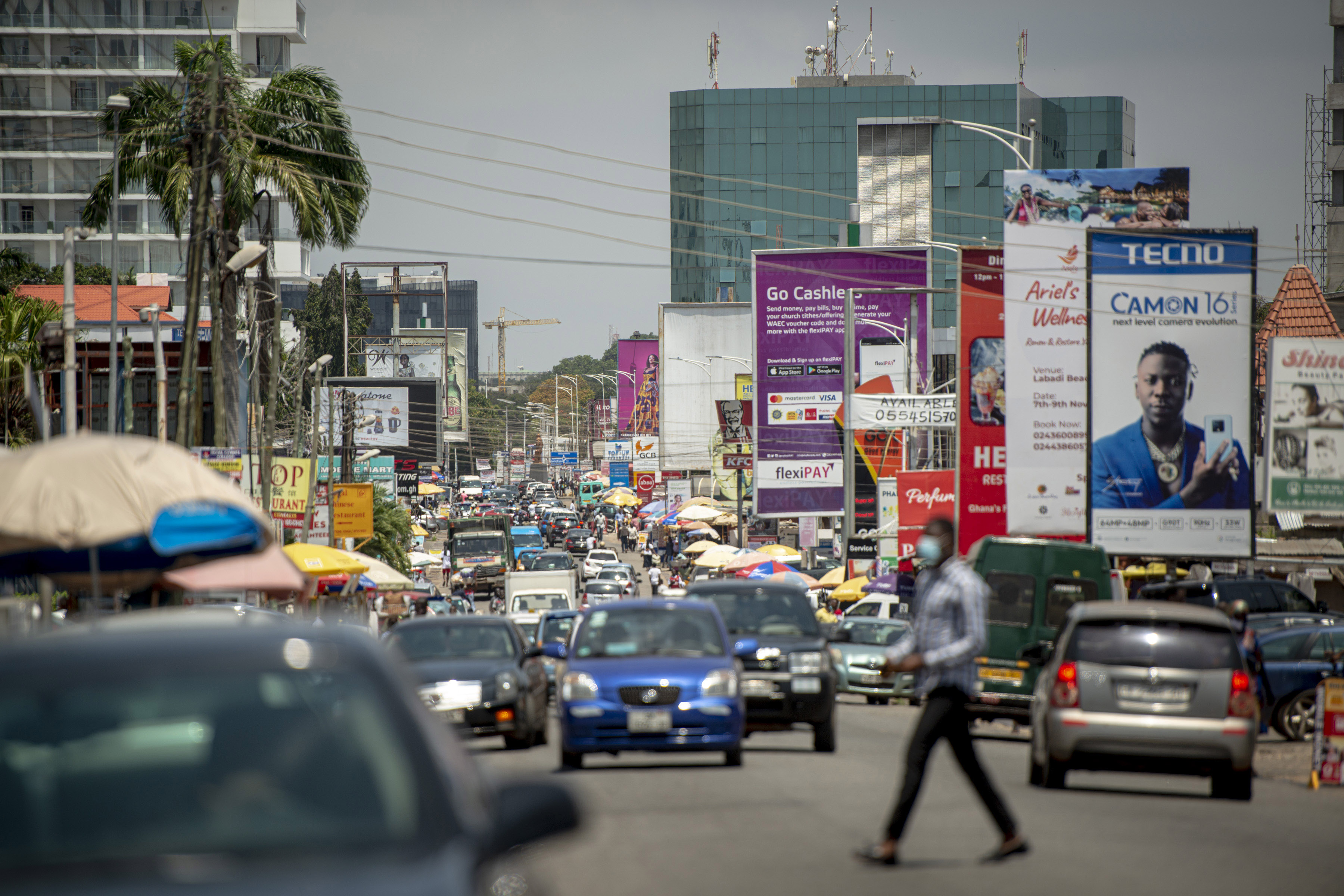 Vehicles travel along a road in Accra, Ghana.