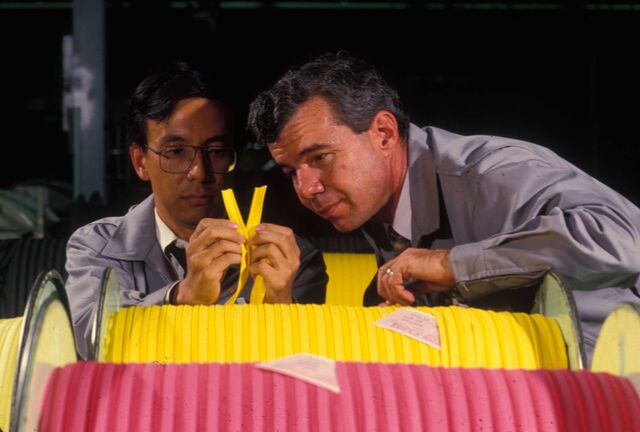 Two workers Inspect yellow and pink zippers at YKK’s factory in Macon, Georgia, in 1985.