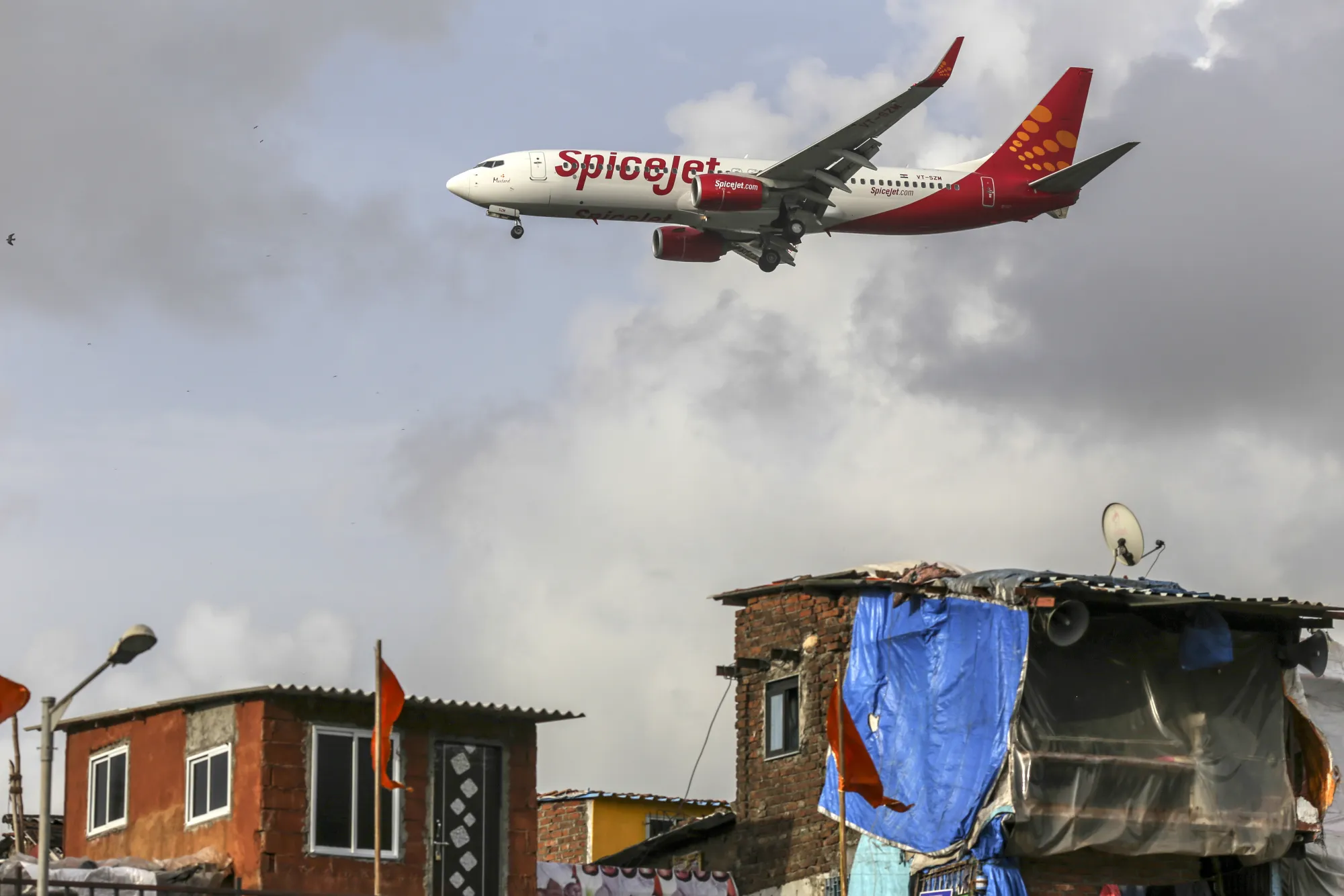 A SpiceJet Ltd. aircraft prepares to land at Chhatrapati Shivaji International Airport in Mumbai, India.