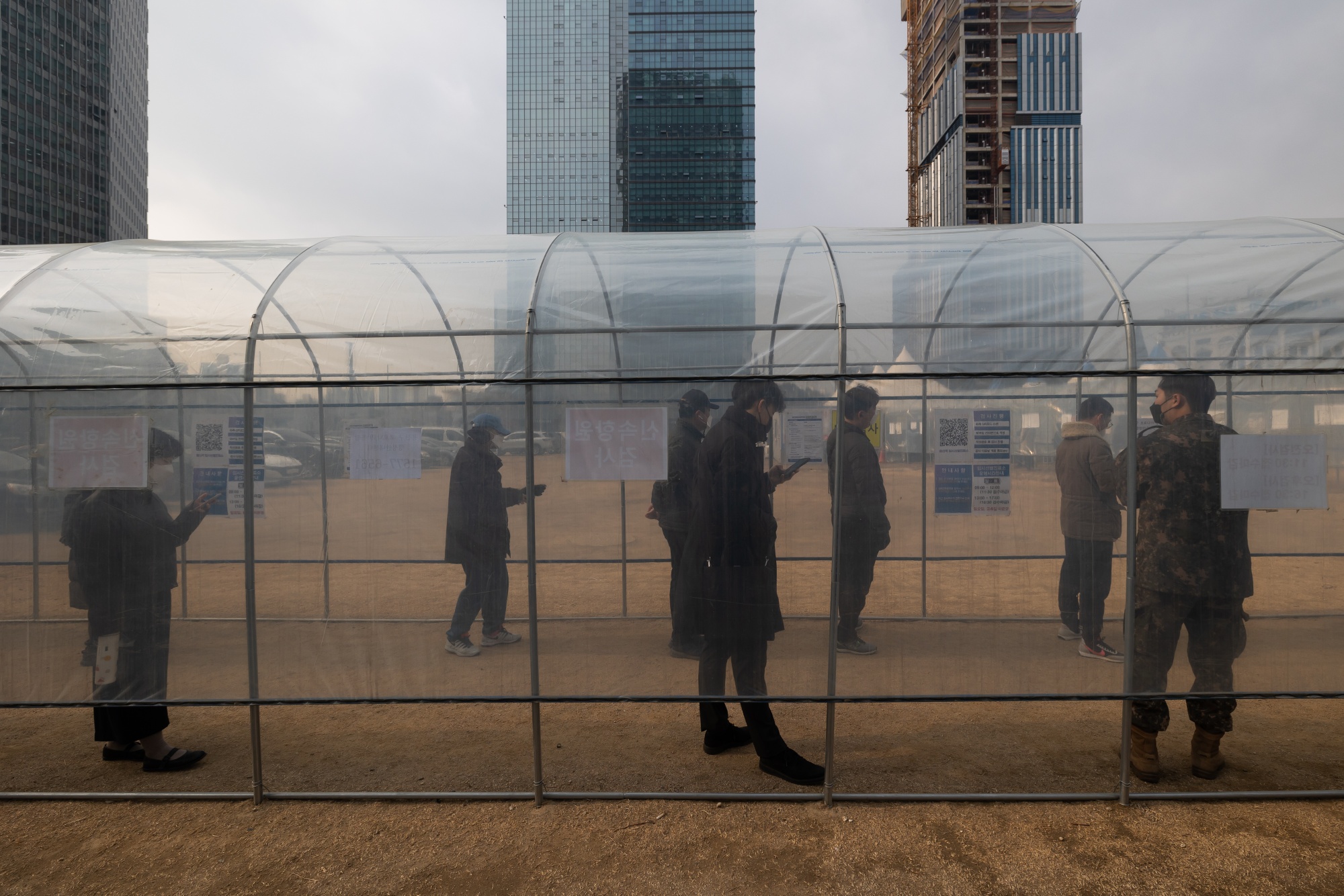 Members of the public wait in line at a temporary Covid-19 testing station outside Yongsan Station in Seoul.