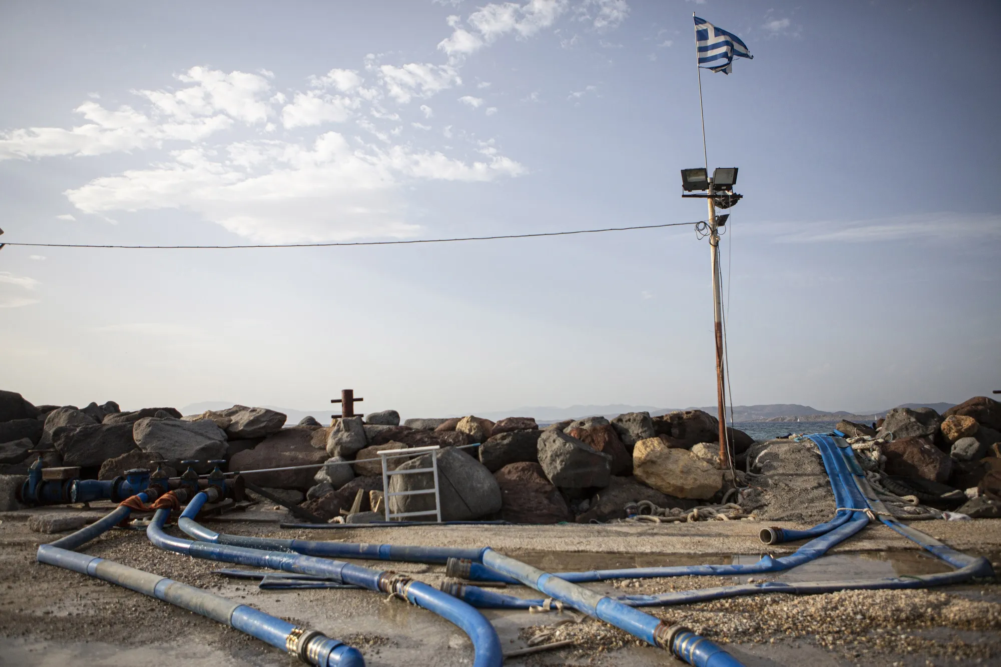 Pipes from a tanker&nbsp;deliver water into the&nbsp;main cistern on the island of Aegina.