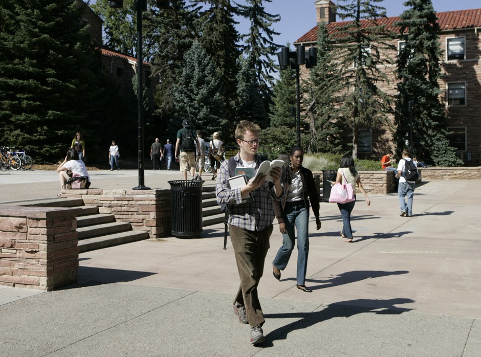 Students walk the University of Colorado campus in Boulder, one of the college towns where startups are growing.